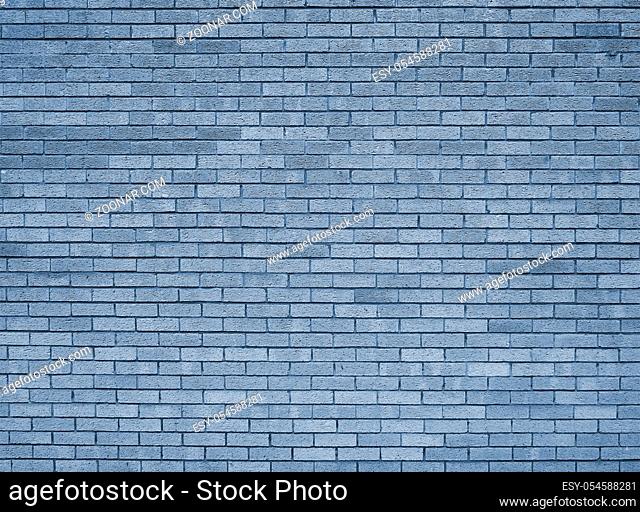 a full frame blue toned textured brick wall background