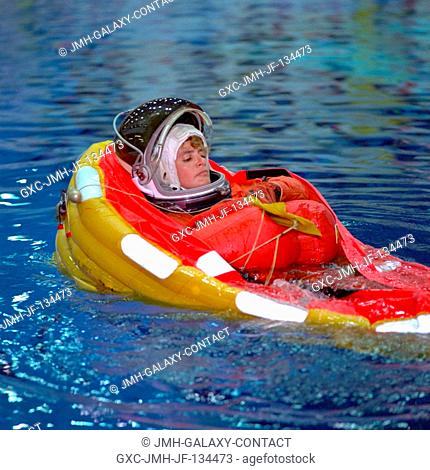 Astronaut Julie Payette deploys a life raft during emergency bailout training. The STS-96 mission specialist, who represents the Canadian Space Agency (CSA)