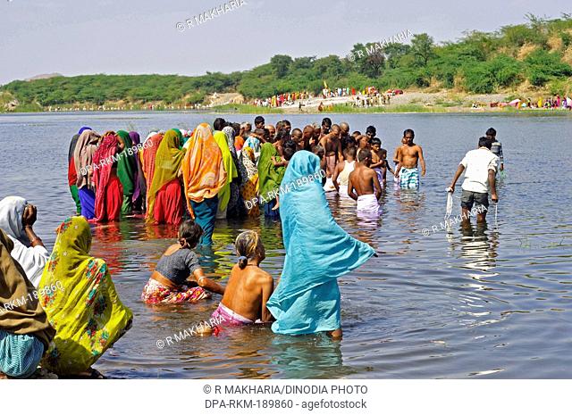 People bathing Beneshwar tribal Fair Dungarpur Rajasthan India Asia