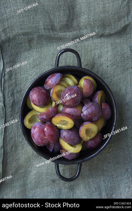 Halved and pitted plums