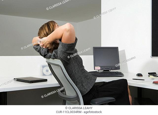 Woman relaxing in office chair