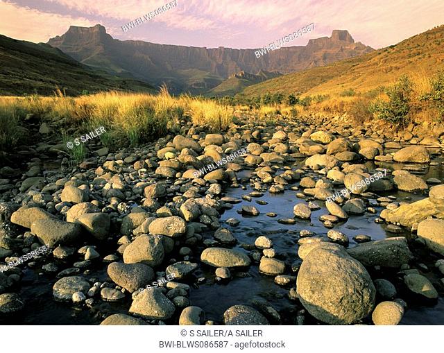 rock face of Mount-aux-Sources with Tugela river in early morning light, South Africa, Kwazulu Natal/Drakensberge, Royal Natal Nationalpark