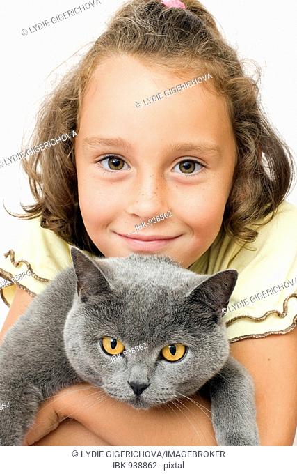 Girl, 6 years, with blue British Shorthair Cat