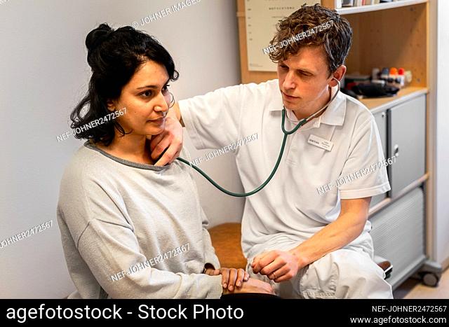 Doctor examining woman
