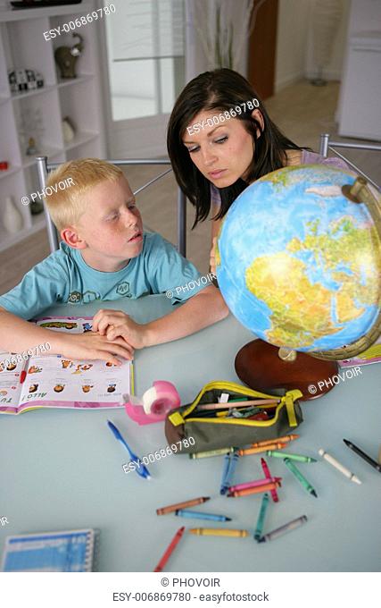 Mother teaching son geography