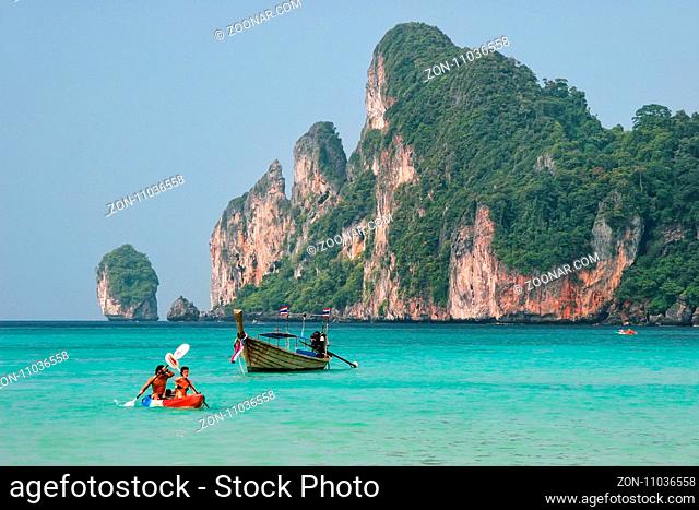 People kayaking at Ao Loh Dalum on Phi Phi Don Island, Krabi Province, Thailand. Koh Phi Phi Don is part of a marine national park
