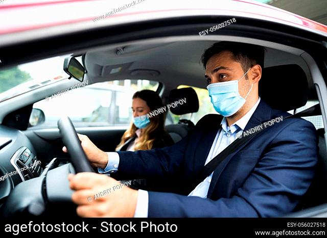 People Carpooling And Car Sharing With Face Masks
