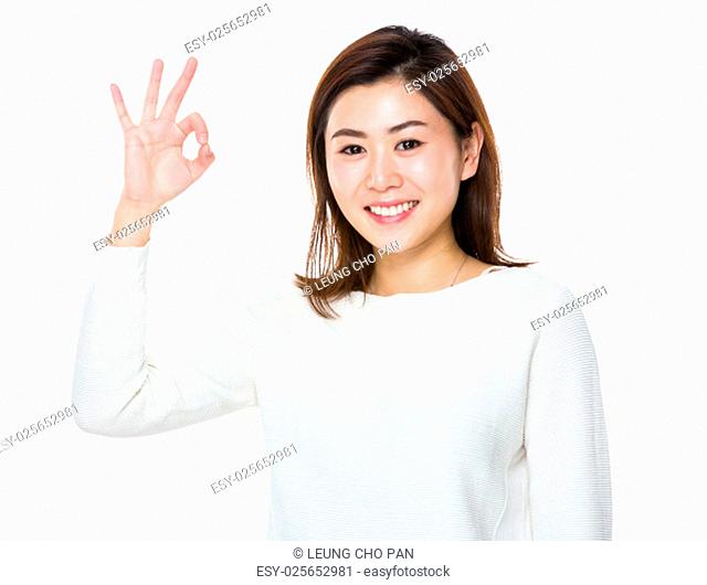 Asian woman with ok sign gesture