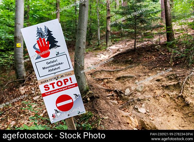 21 September 2023, Baden-Württemberg, Freiburg im Breisgau: A sign with the inscription ""Danger! Mountain Bike Downhill! Baden to the Bone Trail STOP