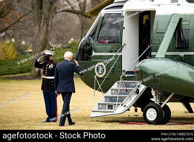 U.S. President Joe Biden salutes the Marine Guard as he boards Marine One at the White House in Washington, D.C., U.S., on Tuesday, March 16, 2021