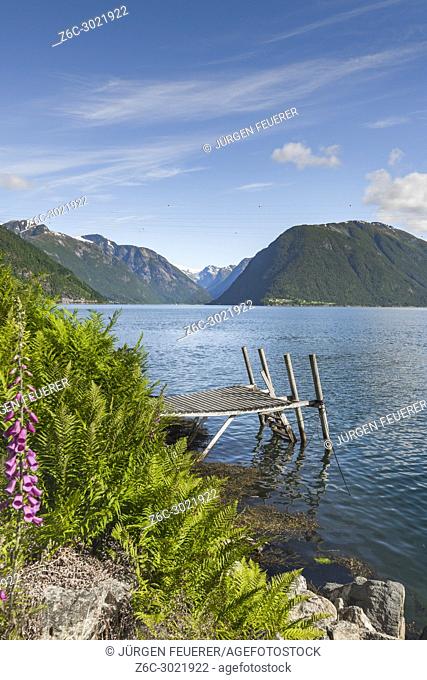 fjord panorama at the ferry station of Balestrand, Norway, Sognefjorden, old wooden landing stage and view direction to Menes and Lustrafjorden