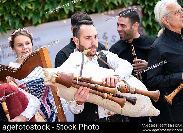 11 September 2022, Baden-Wuerttemberg, Balingen: A musician plays a bagpipe during the festival ""Sackpfeifen in Schwaben"" at the Haus der Volkskunst