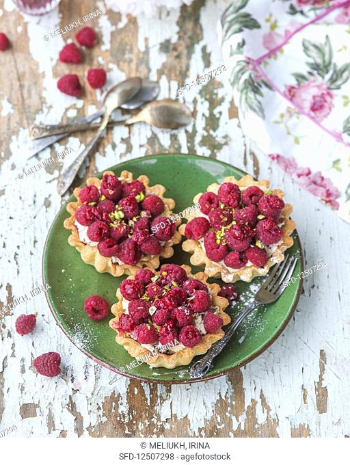 Raspberry pistachio tarts