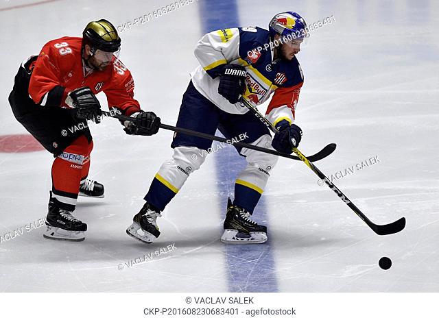 From left: Peter Pucher of Znojmo and Florian Kettemer of Munich in action during the Orli Znojmo vs EHC Red Bull Munchen Champions Hockey League F group game...