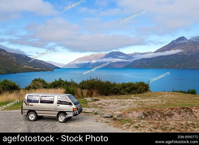 Wye Creek, New Zealand - March 27, 2015: Campervan in front of Lake Wakatipu on the South Island