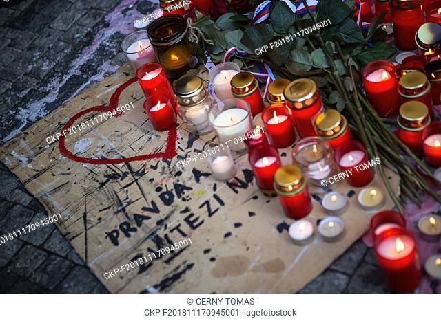 People laid flowers and lit candles in front of the memorial plaque marking the November 17, 1989, in the centre of Prague, Czech Republic, on November 17, 2018