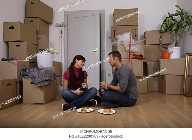 Young Couple Moving Home, Meal Break