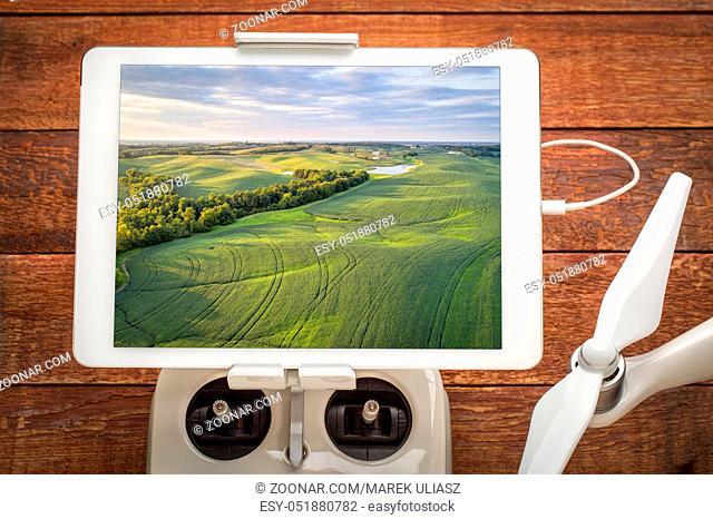 green soy fields in Missouri - reviewing aerial image on a digital tablet mounted on a drone radio controller