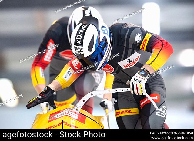 06 February 2021, Saxony, Altenberg: Bobsleigh: World Championship, two-man bobsleigh, men, 2nd run. Francesco Friedrich and Alexander Schüller from Germany in...