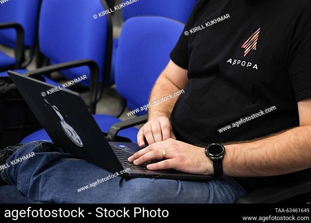 RUSSIA, NOVOSIBIRSK - OCTOBER 17, 2023: A man works on his laptop as Open Mobile Platform has the Russian-made Aurora OS beta tested at the Novosibirsk branch...