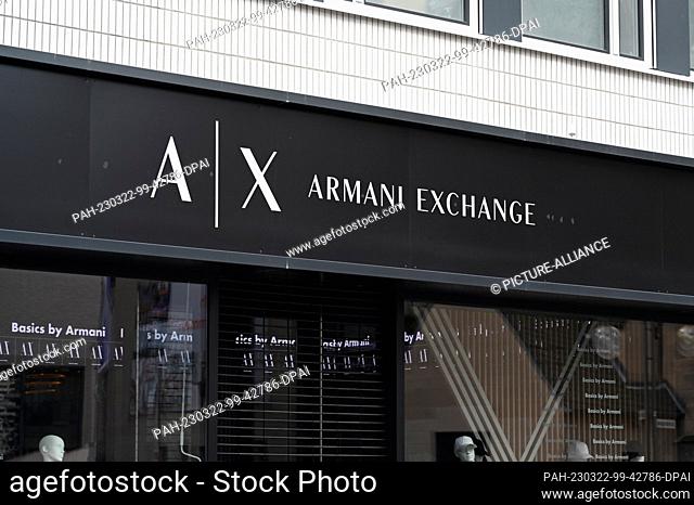 19 March 2023, North Rhine-Westphalia, Cologne: Logo, lettering of the luxury fashion label AX Armani Exchange at a store Photo: Horst Galuschka/dpa