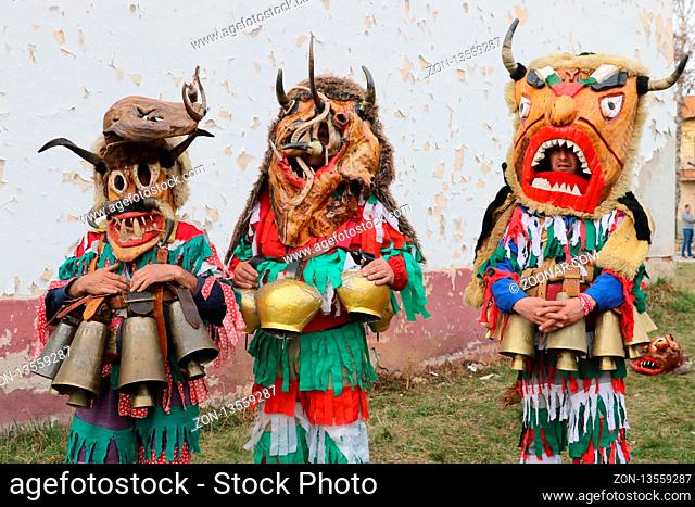 Zemen, Bulgaria - March 16, 2019: Masquerade festival Surva in Zemen, Bulgaria. People with mask called Kukeri dance and perform to scare the evil spirits