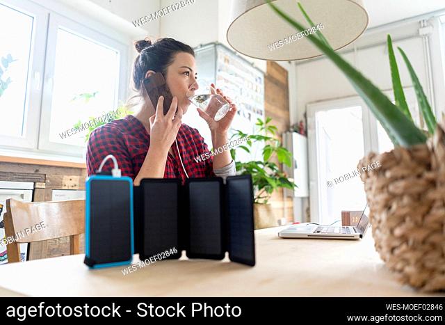 Woman on the phone with solar powerbank