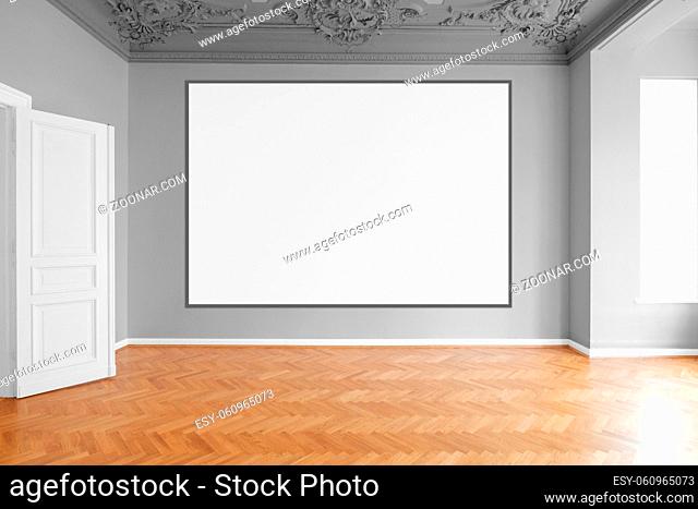 blank canvas or picture frame hanging on white wall in empty room