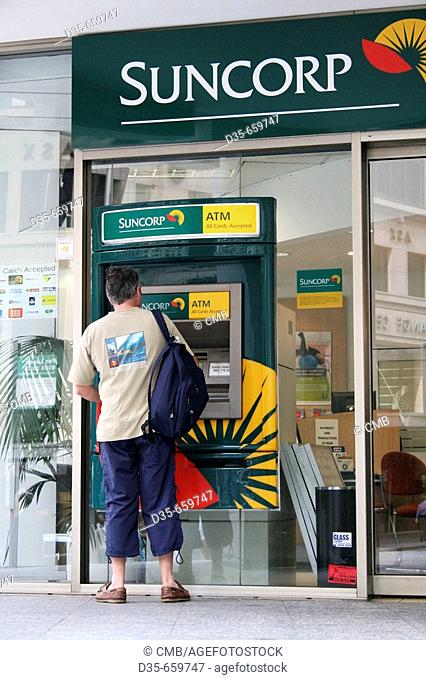 Tourist at ATM machine, George St., Sydney, New South Wales, Australia