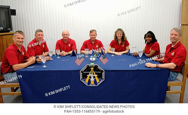 Kennedy Space Center, FL - July 4, 2006 -- Trying a third time for launch, and still smiling, the STS-121 crew gathers again for the traditional breakfast...