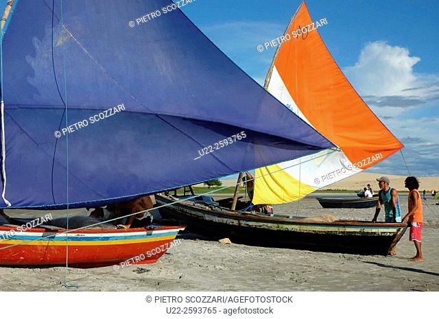 Brazil, Ceara State, Jericoacoara, Fishing Boat and Fishermen along the Beach
