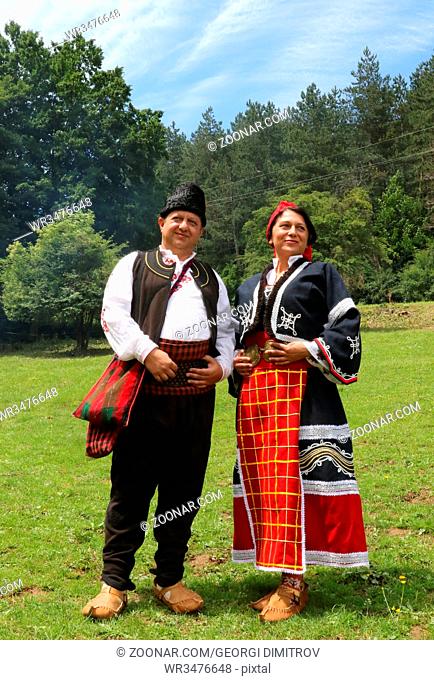 Vratsa, Bulgaria - June 24, 2018: People in traditional authentic folklore costume a meadow near Vratsa, Bulgaria