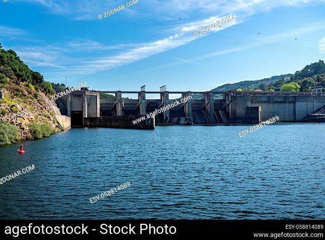Solid structure of the Carrapatelo dam on River Douro in Portugal with the lock gates on the left