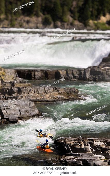 A couple of kayakers paddle the bigwater of the Kootenai River, MT