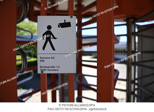 27 July 2018, Germany, Constance: A sign at the entrance to the former Siemens canteen points to the former video surveillance.