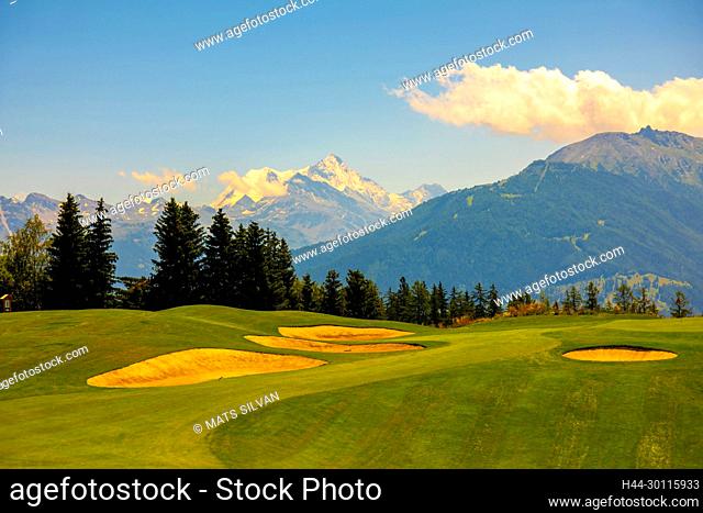 Crans Sur Sierre Golf Course with Hole 7 and Mountain View in Crans Montana in Valais, Switzerland