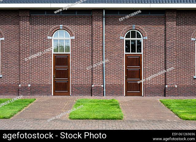 Harskamp, Gelderland, The Netherlands - 07 14 2022 - Brick stone facade of the Restored Reformed church