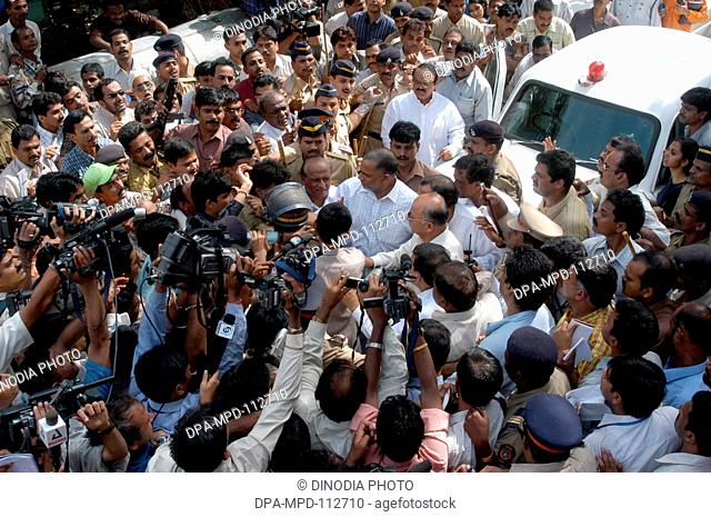 Media thronged to get reactions of chief minister of Maharashtra Sushil Kumar Shinde along with home minister Chhagan Bhujbal and state minister Kripa Shanker...
