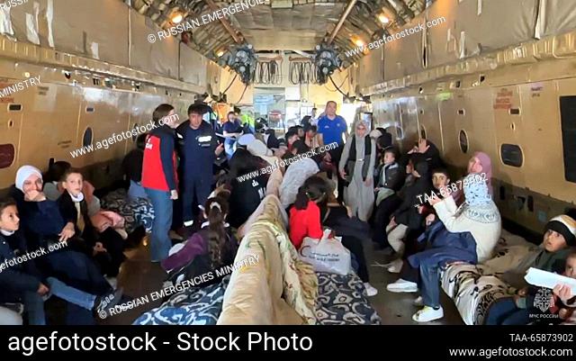 EGYPT, CAIRO - DECEMBER 18, 2023: Russian citizens evacuated from the zone of the Israeli-Palestinian conflict are seen aboard an Ilyushin Il-76 plane of the...