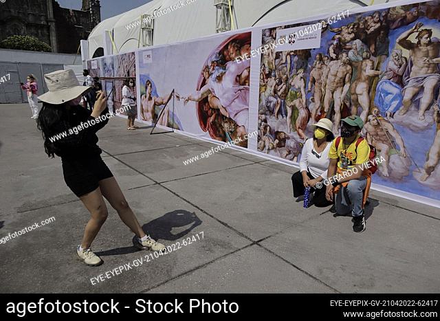 MEXICO CITY, MEXICO - APR 21, 2022: A Visitor takes a photo during a tour of the exhibition at the opening of the replica of Michelangelo's Sistine Chapel in...