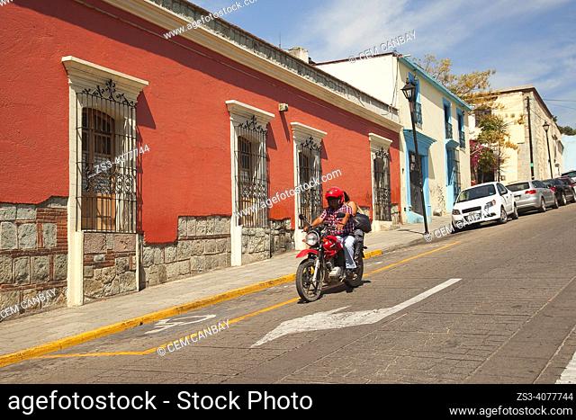 Motorcyclist in front of the colonial buildings at the historic center, Oaxaca, Oaxaca State, Mexico, North America