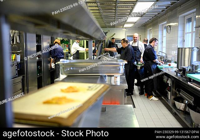 29 March 2023, Berlin: The kitchen team at Bellevue Palace prepares dinner for the state banquet in honor of King Charles III and Queen Camilla at Bellevue...