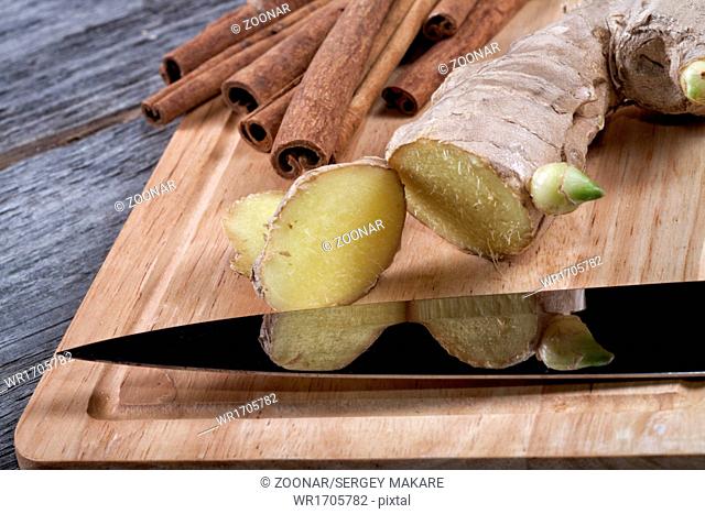 Kitchen knife ginger cinnamon on a chopping board