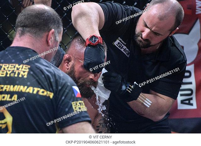 Czech MMA fighter Karlos Vemola (center) refreshes in fight with French fighter Prince Aounallah during the Night of Warriors gala evening on April 6, 2019