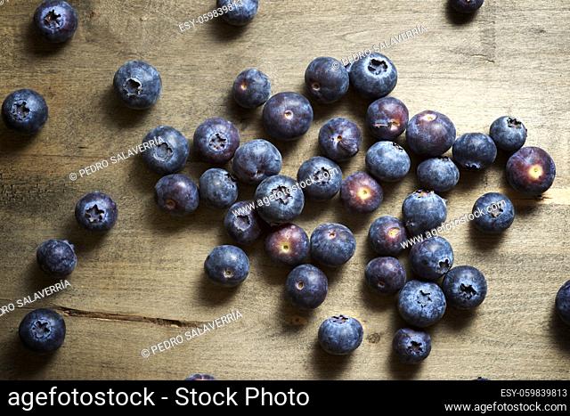 Close up of a blueberries ion a wood table