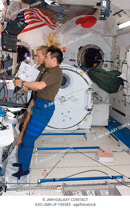 Japan Aerospace Exploration Agency astronaut Akihiko Hoshide and NASA astronaut Karen Nyberg, both STS-124 mission specialists