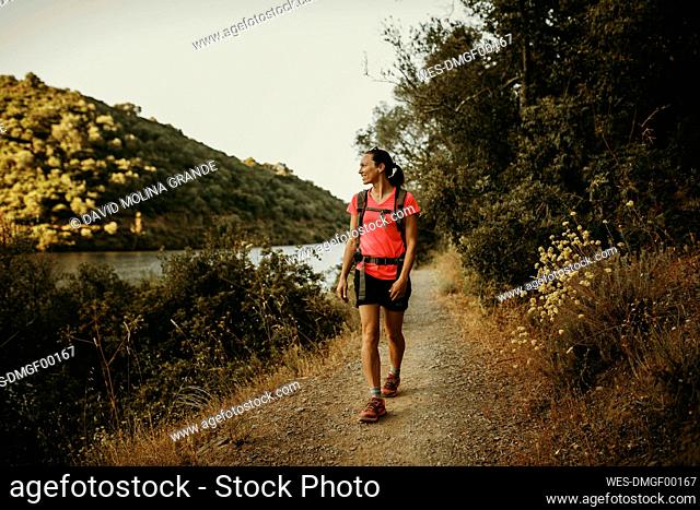 Trekker walking on footpath at Sierra De Hornachuelos, Cordoba, Spain