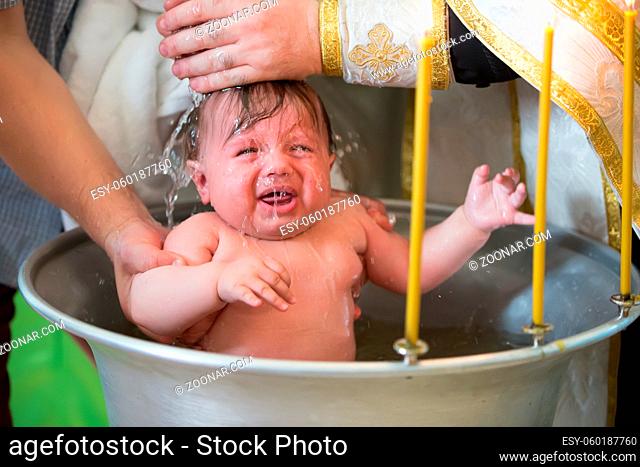 Baptism of a child. Ablution in holy water. Accepting faith. Orthodox baptism