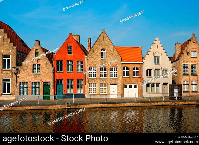 Typical Belgian cityscape Europe tourism concept - canal and old houses on sunset. Bruges (Brugge), Belgium