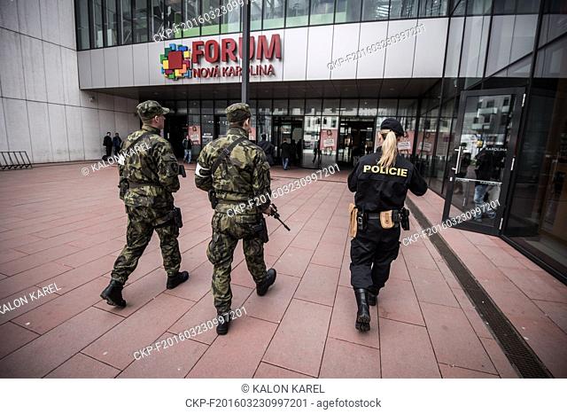 Police officers and soldiers patrol the shopping centre Forum Nova Karolina in Ostrava, Czech Republic, Wednesday, March 23, 2016